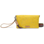 Yellow clutch bag with speckled pattern and colorful strap on a white background