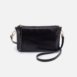 Black leather crossbody bag on a light gray background