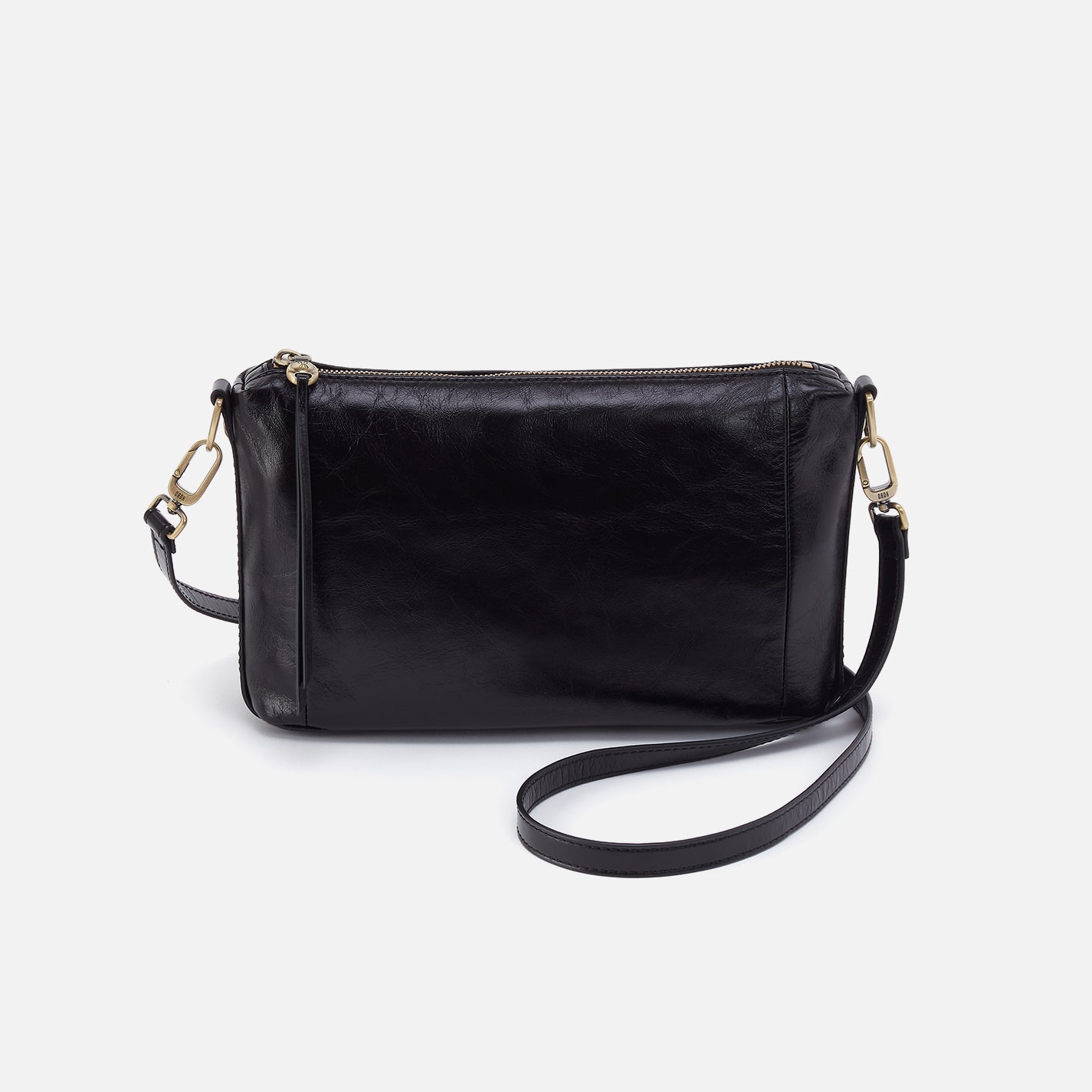 Black leather crossbody bag on a light gray background
