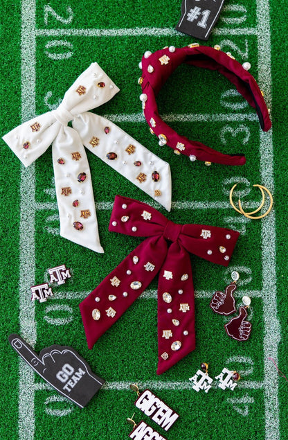 Accessories including headbands and hair bows on a football field background