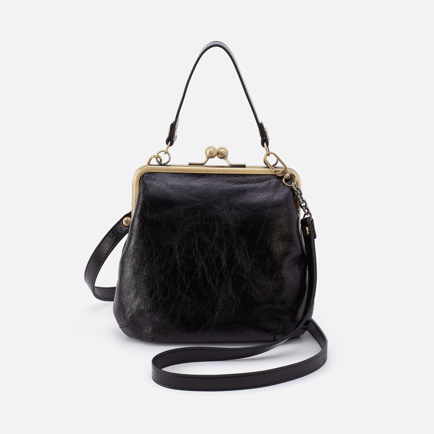 Black leather handbag with gold clasp on a white background