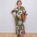 Woman wearing a floral dress with a white background