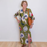 Woman wearing a floral dress with a white background