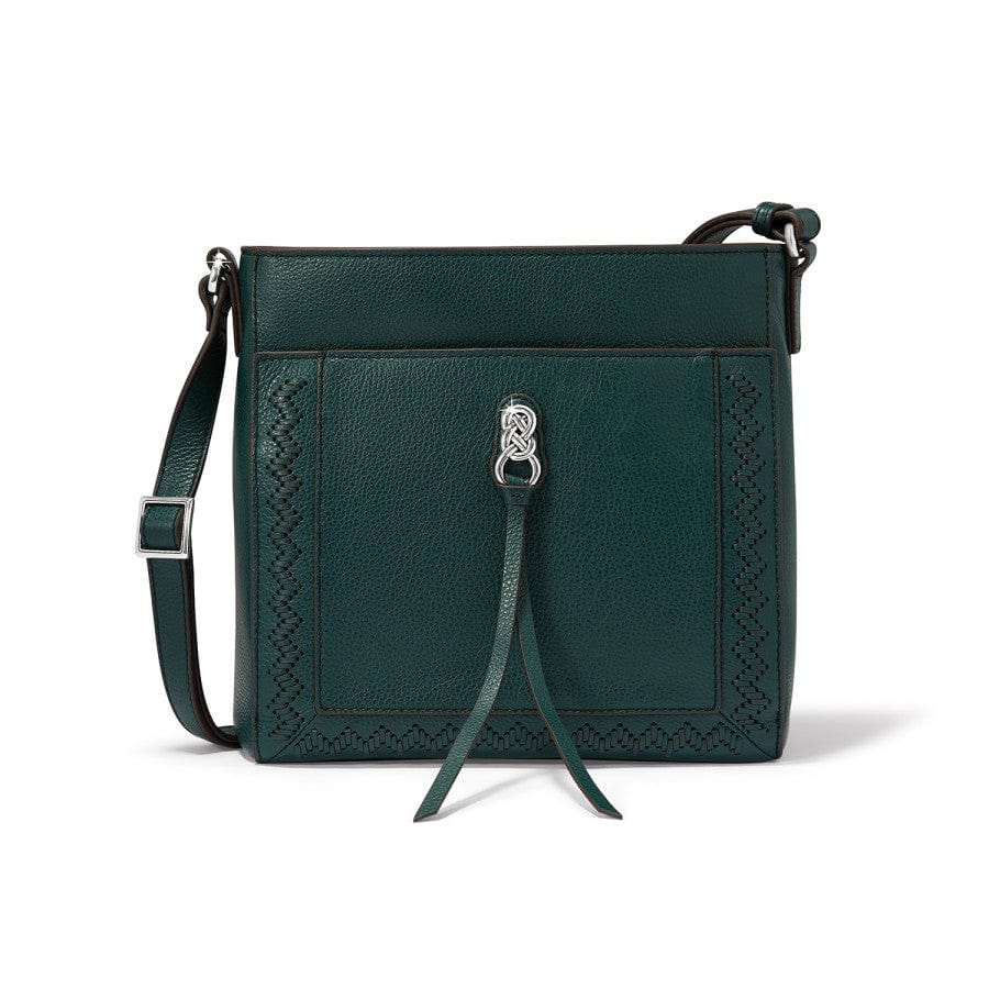 Green leather handbag with decorative strap on a white background