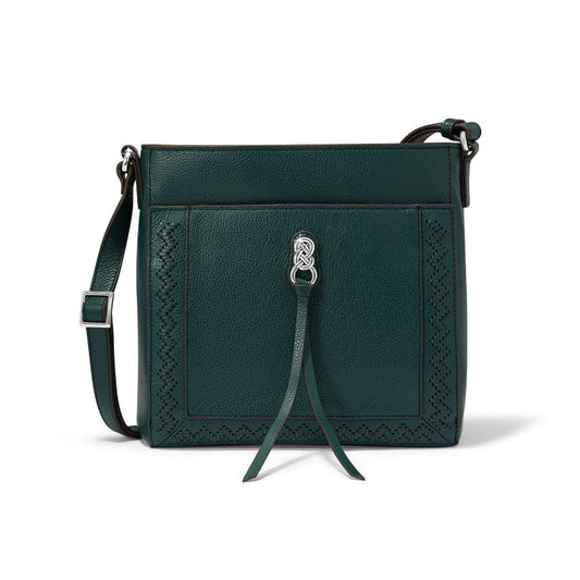 Green leather handbag with decorative strap on a white background