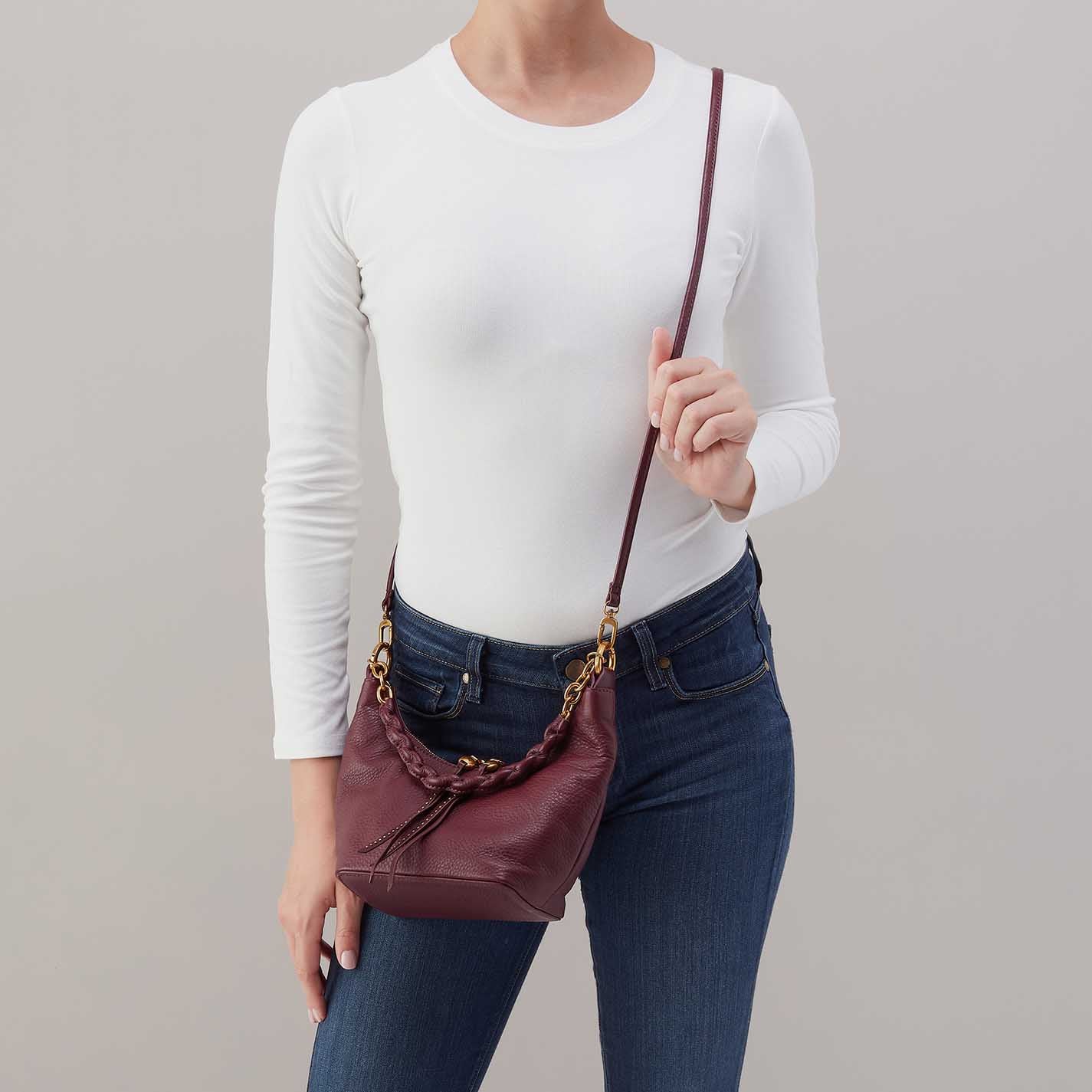 Hobo Astrid Small Crossbody in mulberry glaze leather with top zip closure and adjustable strap.