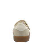 Beige shoe with a brown sole on a white background