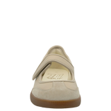 Beige shoe with a brown sole on a white background