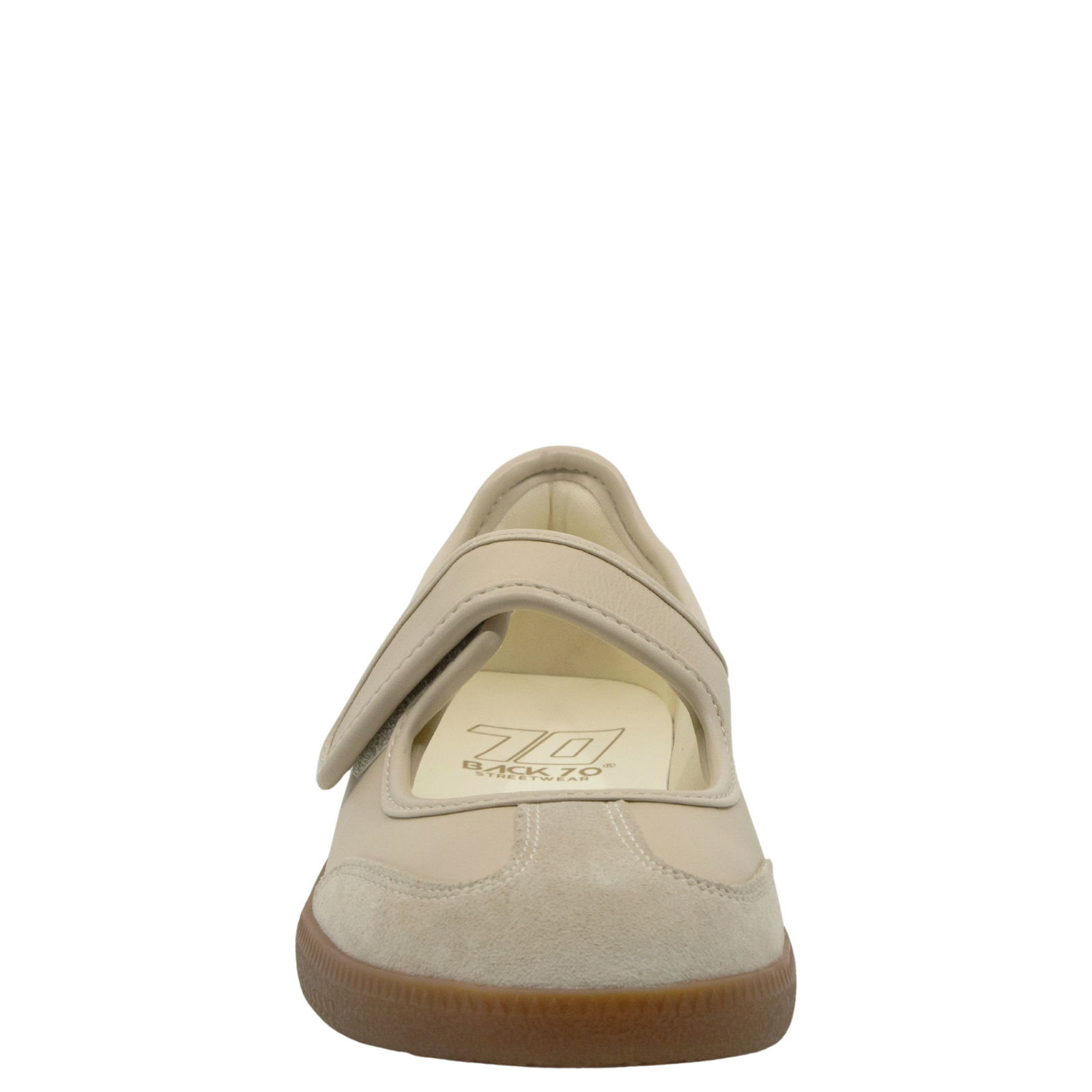 Beige shoe with a brown sole on a white background