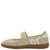 Beige shoe with a brown sole on a white background
