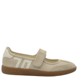 Beige shoe with a strap on a white background