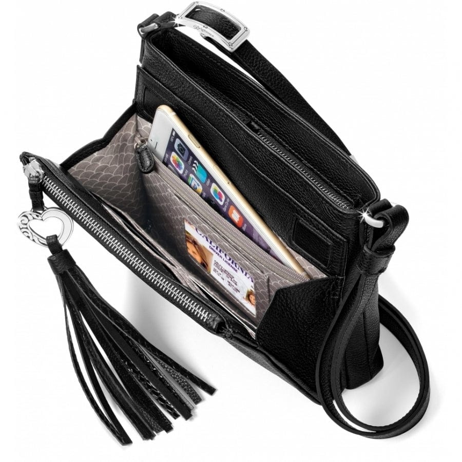 Black leather crossbody bag with a heart-shaped clasp and tassel on a white background