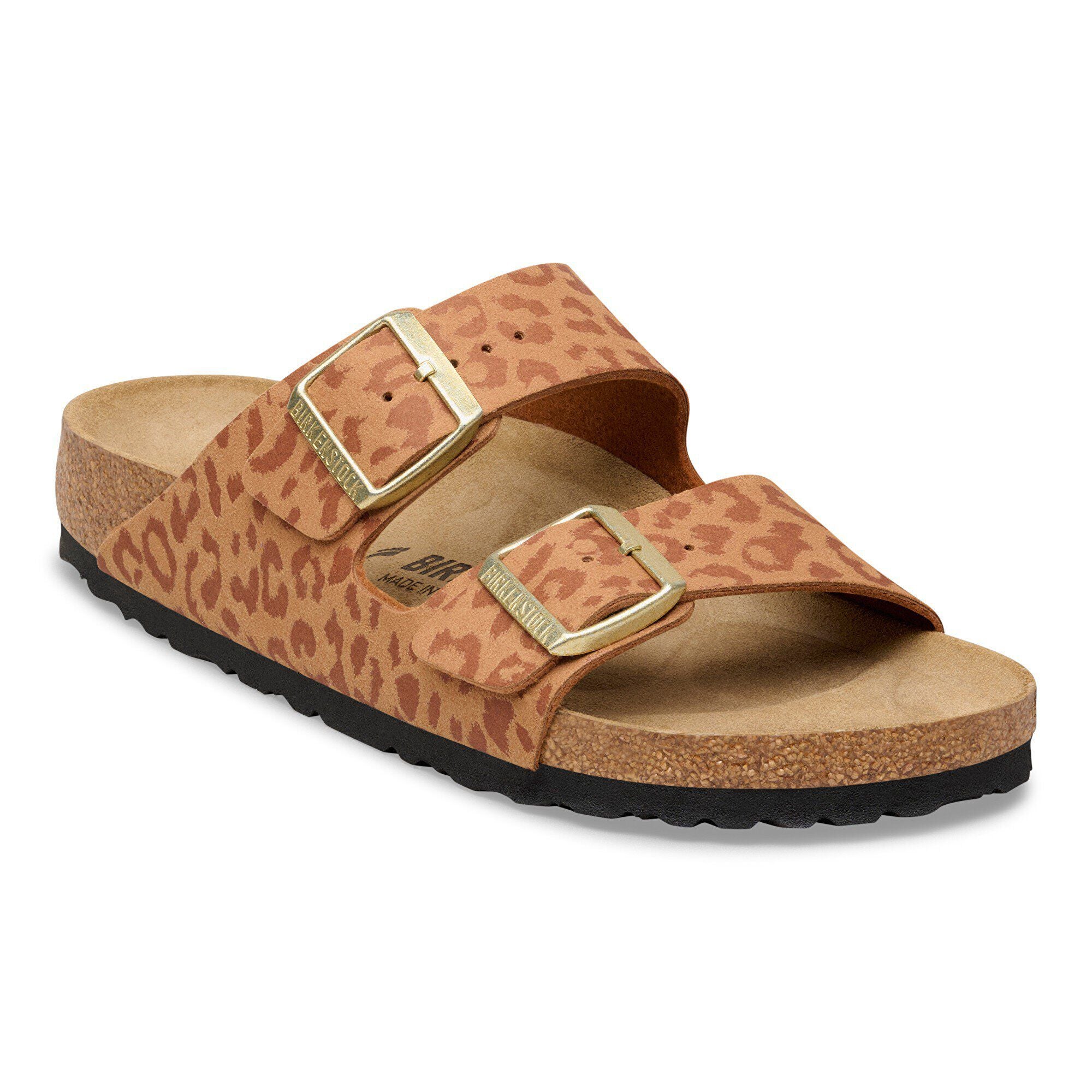 Brown sandal with gold buckle on a white background