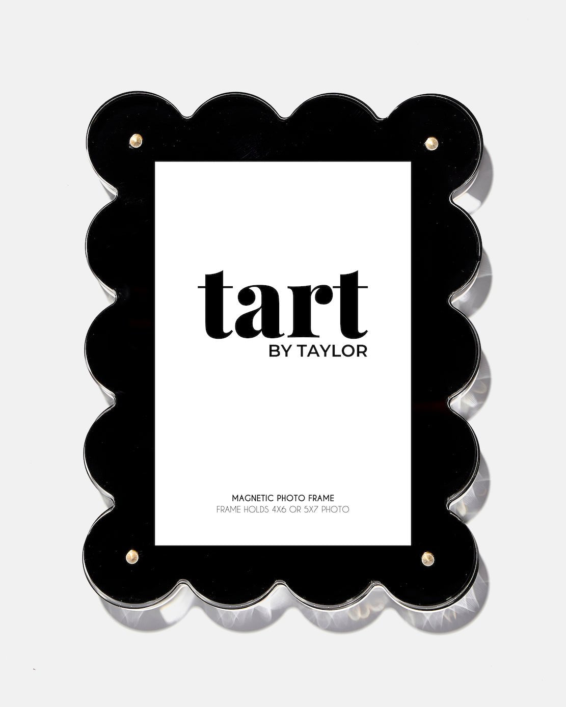 Black scalloped photo frame with 'tart by Taylor' branding on a white background