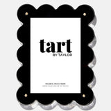 Black scalloped photo frame with 'tart by Taylor' branding on a white background