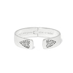 Silver bracelet with heart-shaped ends and engraved text on a white background