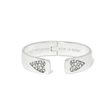 Silver bracelet with heart-shaped ends and engraved text on a white background