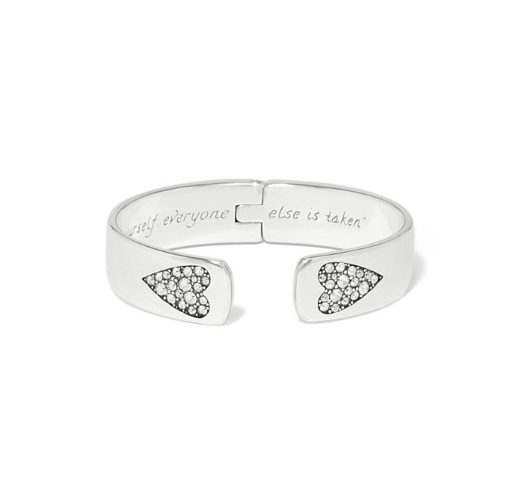 Silver bracelet with heart-shaped ends and engraved text on a white background