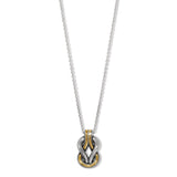A two-tone necklace with a geometric pendant.