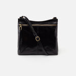 Black leather handbag with a shoulder strap on a white background