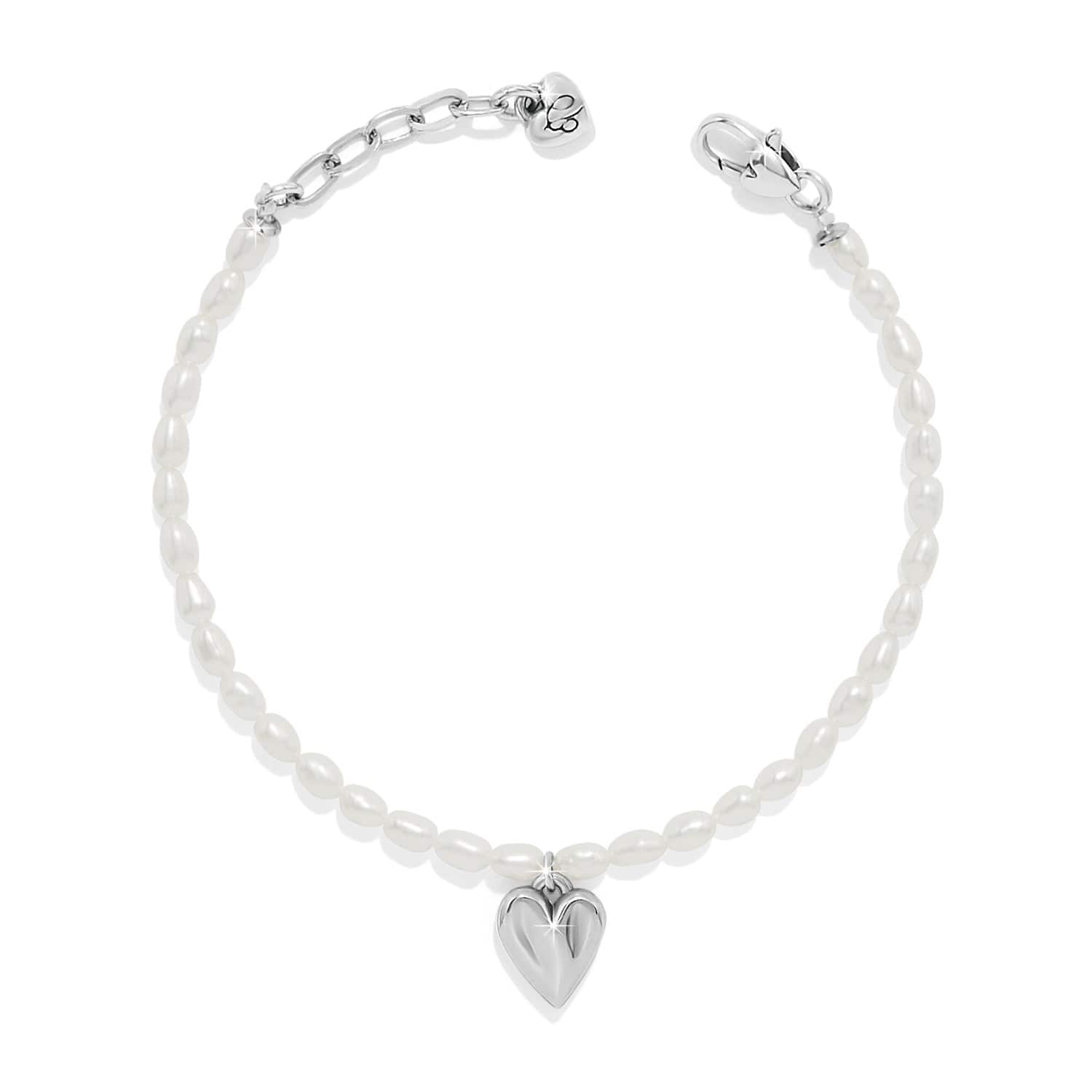 Silver bracelet with a heart charm on a white background