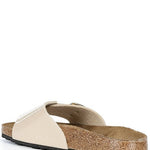 Beige sandal with cork sole on a white background