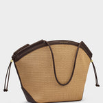 Beige handbag with brown accents on a light gray background