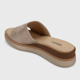 Beige sandal with a brown sole on a light gray background