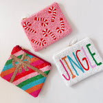 Three colorful beaded pouches with different designs on a white background