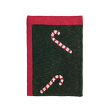 Dark green fabric with red border and candy cane patterns on a white background