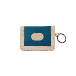 Blue and beige cardholder with keychain on a white background