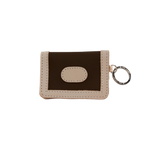 Small brown and beige wallet with a keychain on a white background