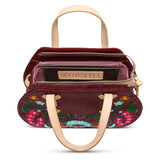 Handbag with floral embroidery and visible brand name on a white background