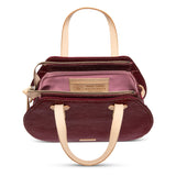 Maroon handbag with beige handles and trim on a white background