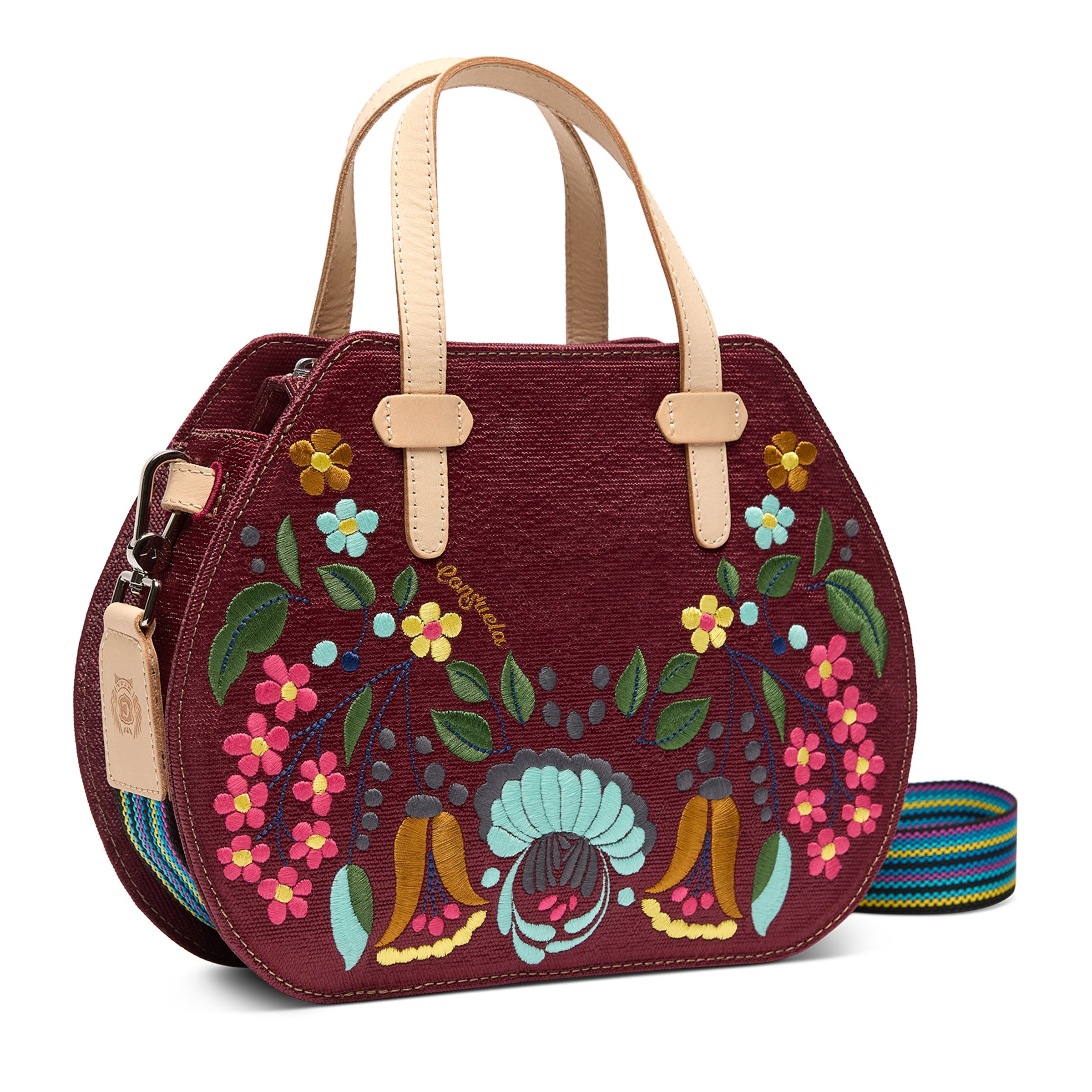 Decorative handbag with floral patterns on a white background