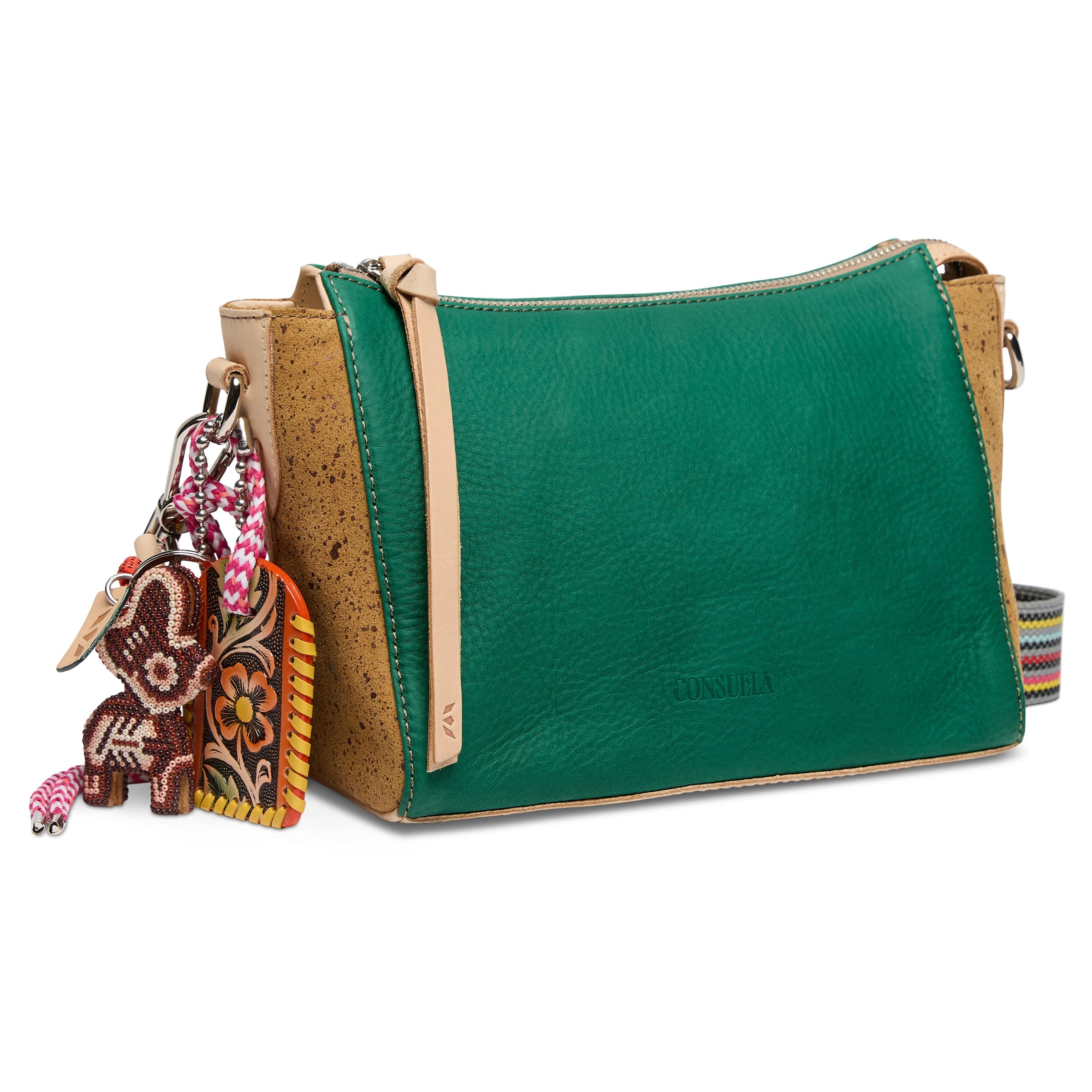 Green handbag with cork accents and a keychain on a white background