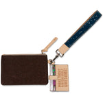 Brown clutch with a strap and small book-shaped pouch on a white background