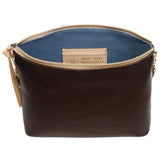 Brown leather pouch with blue interior and visible brand label on a white background