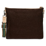Brown crossbody bag with a strap featuring colorful patterns on a white background