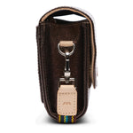 Brown leather key case with a keychain on a white background
