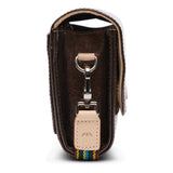 Brown leather key case with a keychain on a white background