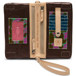 Brown wallet with colorful patches and a strap on a white background