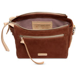 Brown leather handbag with visible brand name on a white background