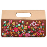 Floral embroidered clutch bag with beige top handle on a white background