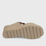 Beige sandal sole with textured surface on a light gray background