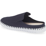 A single slip-on clog-style shoe in dark navy blue canvas with a white ridged sole, shown from a side angle on a white background.