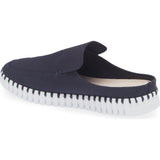A single slip-on clog-style shoe in dark navy blue canvas with a white ridged sole, shown from a side angle on a white background.
