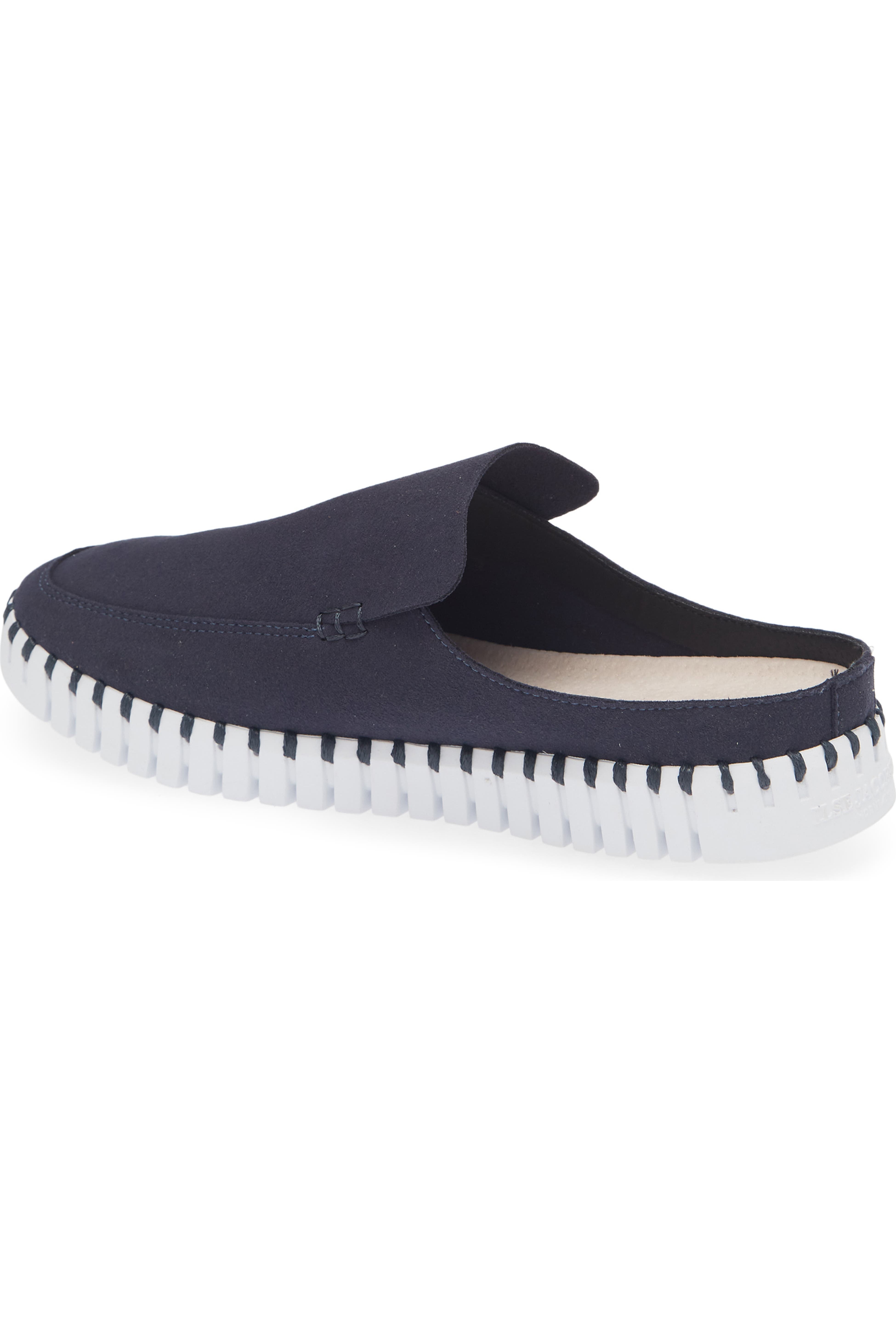 A single slip-on clog-style shoe in dark navy blue canvas with a white ridged sole, shown from a side angle on a white background.