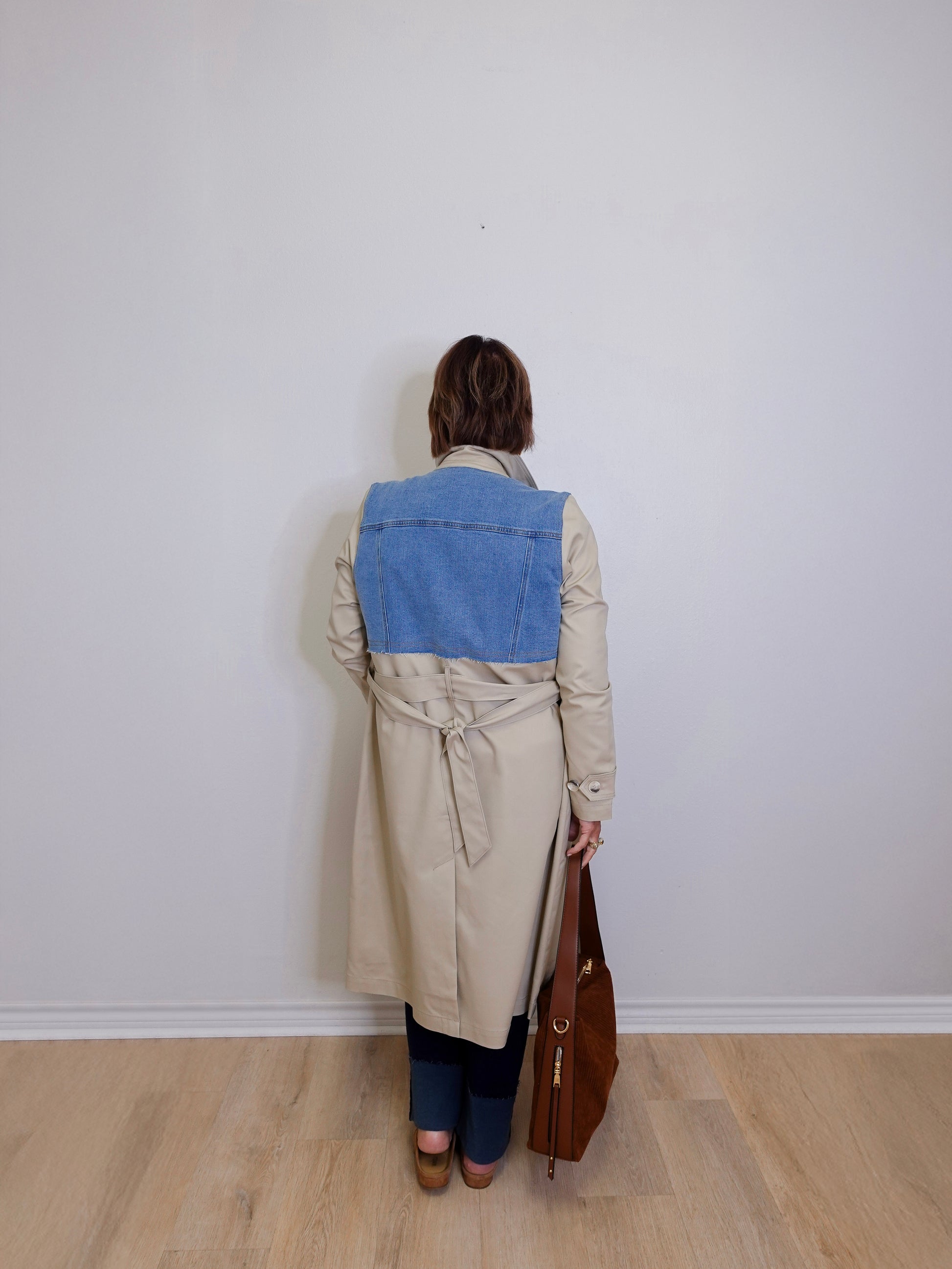 woman wearing a long trench coat 