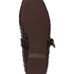 Brown shoe sole with woven pattern on a white background